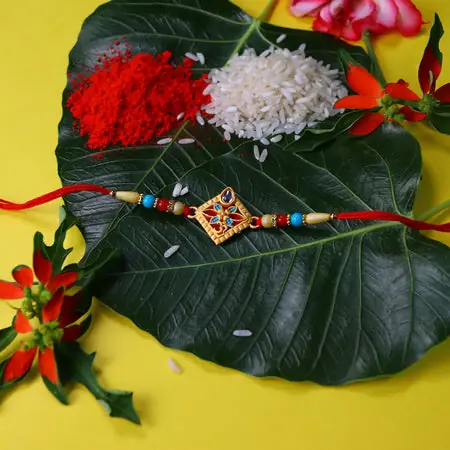 Traditional Diamond-shaped Rakhi With Stone Embellishments And Multicolor Beads
