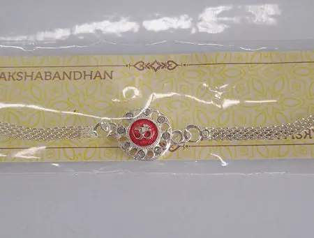 Silver Plated Om Rakhi With Red Enamel And Chain Thread Design