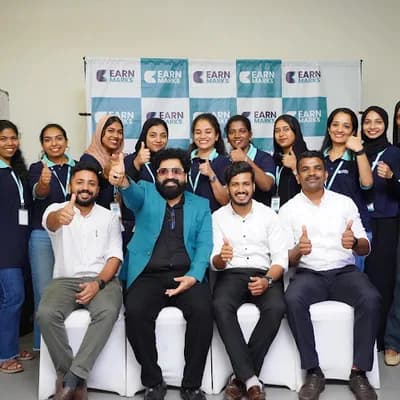 Earn Marks Kannur logo