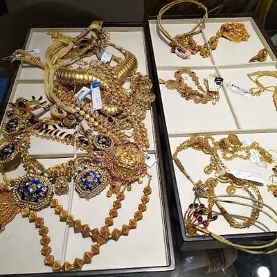 Tanishq Jewellery Trivandrum M G Road logo