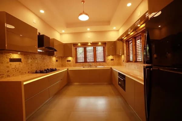 Indoor Stainless Steel Kitchen — Construction & Building in Koodathai, Cheruvannur