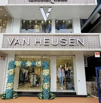 Van Heusen Men Clothing Store Alleppey logo