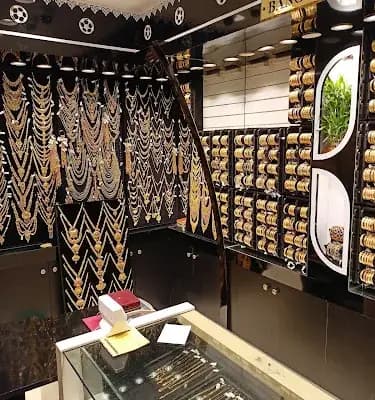 Chemmanur International Jewellers logo