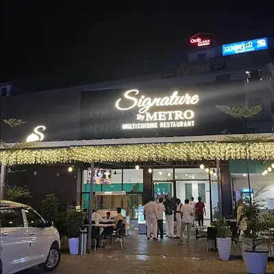 Signature By Metro Multicuisine Restaurant Kasaragod logo