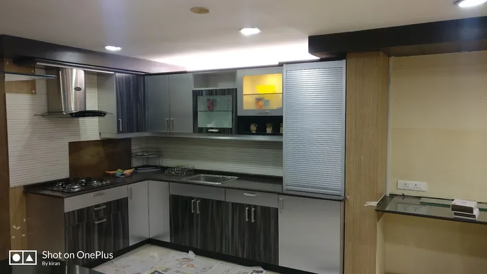 Kurikkal Kitchen Solutions Sleek Studio Modular Kitchen Cabinets Wardrobe And Fitted Furniture — Modular Kitchens & Wardrobes in Kannur