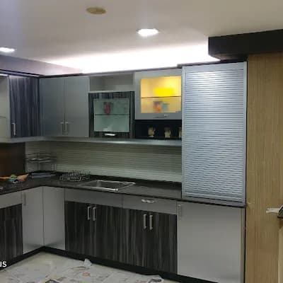 Kurikkal Kitchen Solutions Sleek Studio Modular Kitchen Cabinets Wardrobe And Fitted Furniture logo