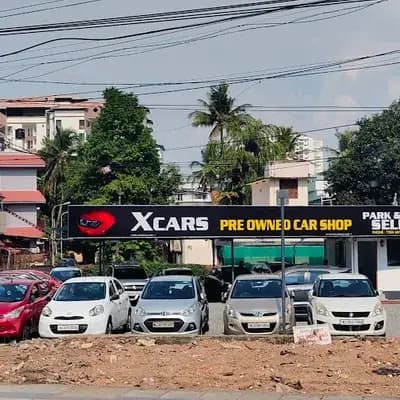 X Cars Used Cars Showroom logo