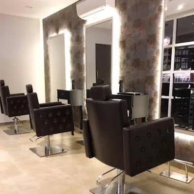 Uptown Salon And Spa logo