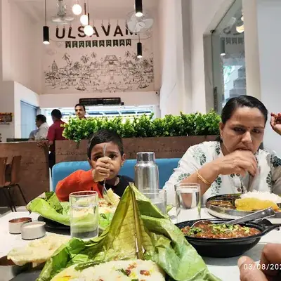 Ulsavam Restaurant in Kozhikode logo