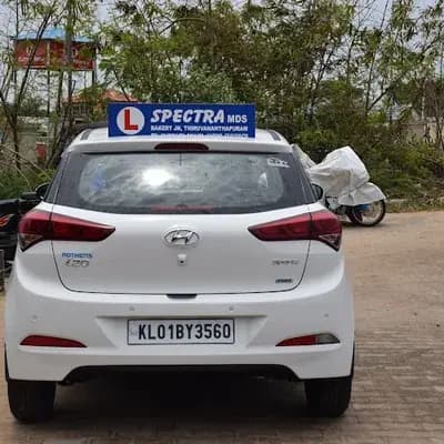 Spectra Motor Driving School logo