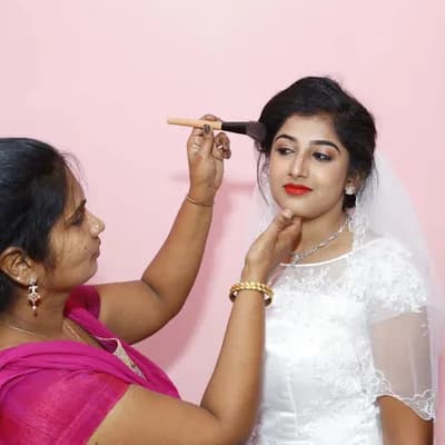 The Feminas Salon And Bridal Studio Kollam logo