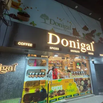 Donigal Spices Dry fruits & Nuts Mattannur logo