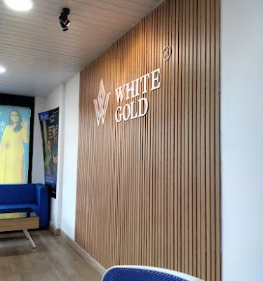 White Gold Kannur Turn Your Gold Into Money logo