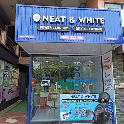 Neat And White Power Laundry And Drycleaning Centre logo