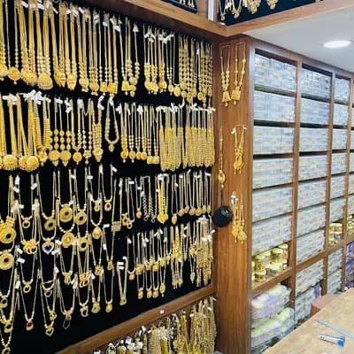 Nesco Gold Covering Thirur Ponnu Wholesale logo
