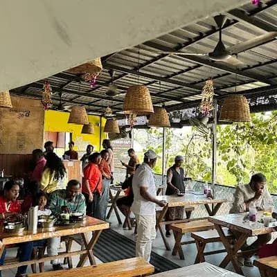 TUSKER CAF'E | Restaurant | Thekkady logo