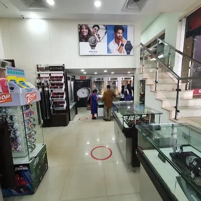 Titan World Fort Road Kannur logo
