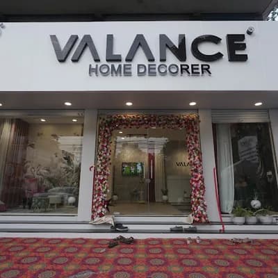 Valance Home Decorer | Luxury Curtain Blinds Wallpaper And Upholstery Fabrics Shop And Curtain Cleaning In Kottayam Kerala logo