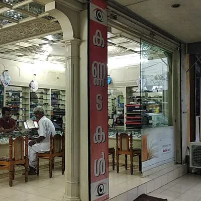 Tharamannil Opticals logo