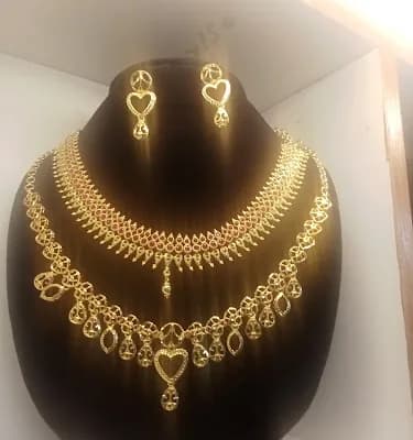 Alif Gold Covering And Silver logo