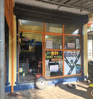 R M Tyre Works logo