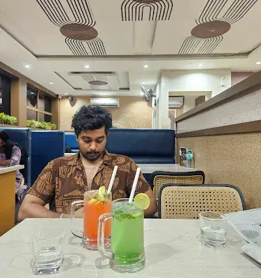 Lollino Cafe Cheruvathur logo